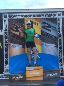show up and race your race - woman on podium