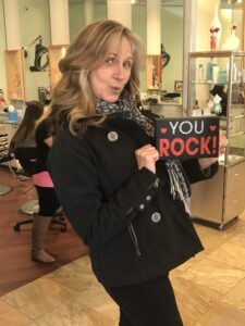 - woman holding sign you rock