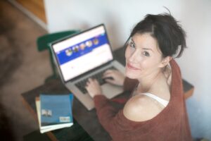5 Tips To Feel Fit And Sexy At Any Age - woman typing on lap top