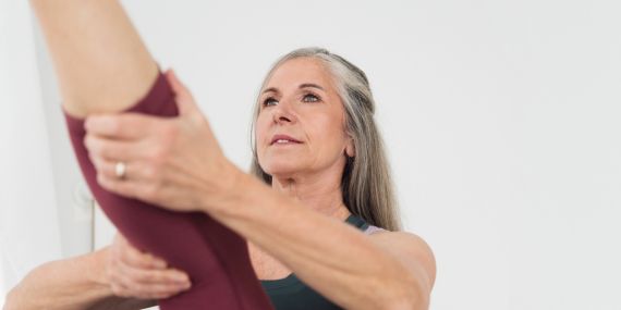 Pilates Over 50 - Is It Too Late To Start Now? - woman doing Pilates
