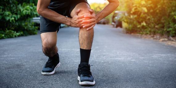 How To Prevent And Relieve Joint Pain For Over 50s -man holding sore knee