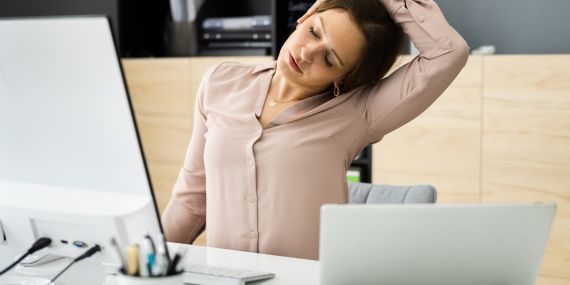 5 Ways To Be Healthier At Work Every Day -woman stretching