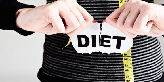 Deconstructing Diets - Which One Is Right For You? - ripping a diet sign appart