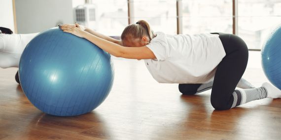 Pilates Over 50 - Is It Too Late To Start Now? - woman Pilates on the ball