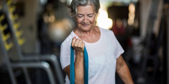 What Exercises Are Best For Over 50's? - woman working with a band