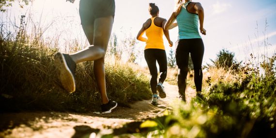 5 Ways To Switch Your Strength and Flexibility Mindset - women running on a trail