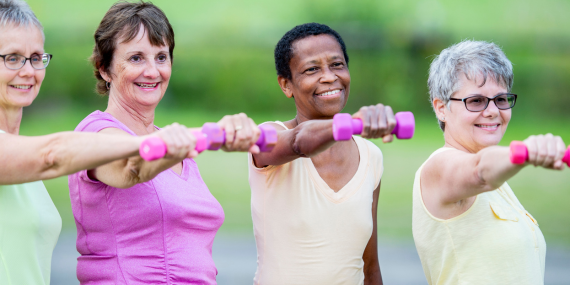 5 Crucial Bone Health Strategies In Midlife - women lifting pink weights
