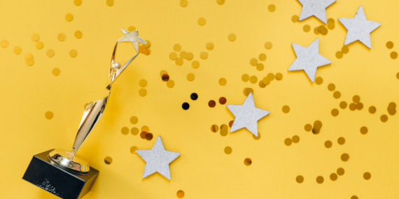 celebrating with stars on a yellow background