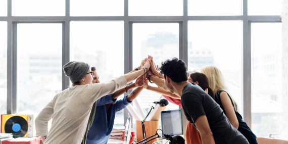 Wellness in the workplace - people high five