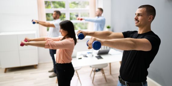 people doing weights at work standing