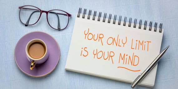 Find Your Focus and Energy By Breaking Through Overwhelm - glasses, coffee cup and sign saying your only limit is your mind