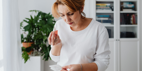 woman looking at notes and overthink in midlife of what to do next