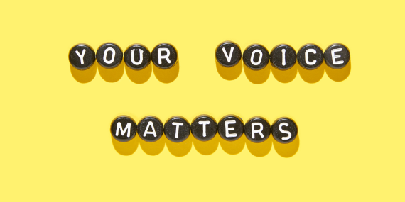 yellow sign saying your voice matters