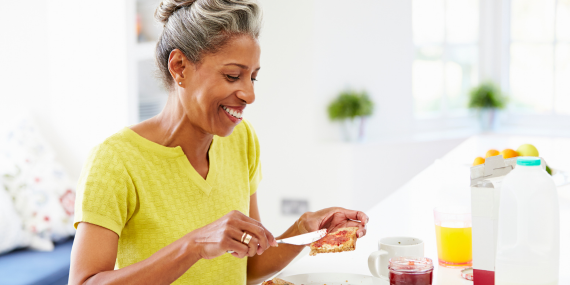 Rebuild Healthy Habits Without Starting Over: A Midlife Eating Reset-Midllife woman enjoing an afternoon snack