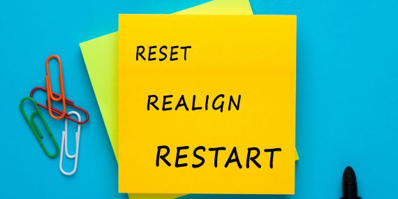 Midlife reset for people in midlife. Stop starting over when you can keep going.
sticky note with the words reset, realign, restart on it.