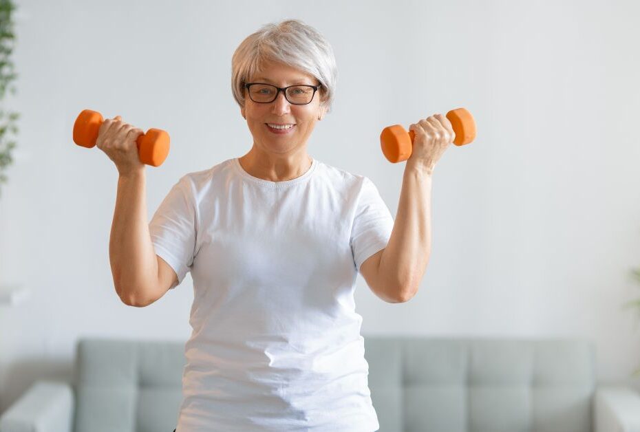 Stop starting over in midlife. Women lifting orange weigths.