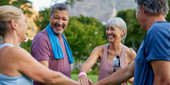 Fitness After 50: Why Your Body Feels Different. two adult couples over 50 doing a fits pump after their exercise