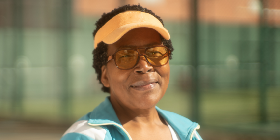 Fit strong women over 50 smiling after her fitness workout