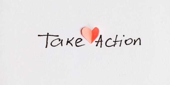 A take action sign with a read heart in the middle for midlife fitness. 
