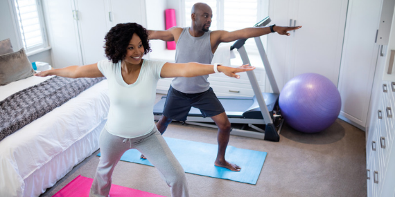 Couple working out together at home